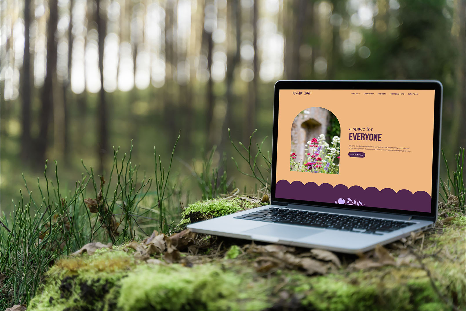 Image of a laptop in the woods showing the Walled Garden website